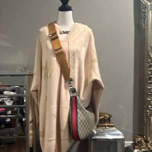 Brand new oversize sweater  lt has a hoodie and gold stars. So soft and warm